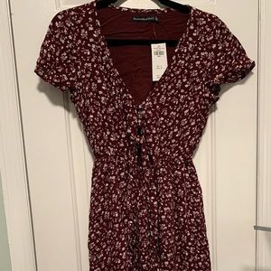 Abercrombie & Fitch maroon floral high low dress with cutout/tie detail.